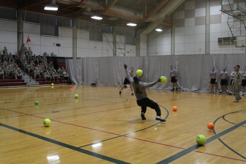 a group of young men playing a game of tennis