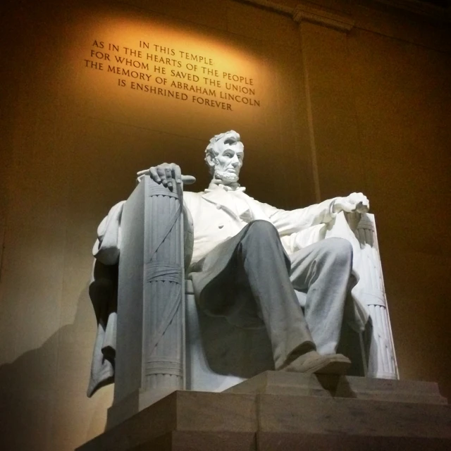 a very big statue sitting in a room