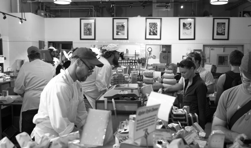 a man wearing a cap looking at soing in front of him