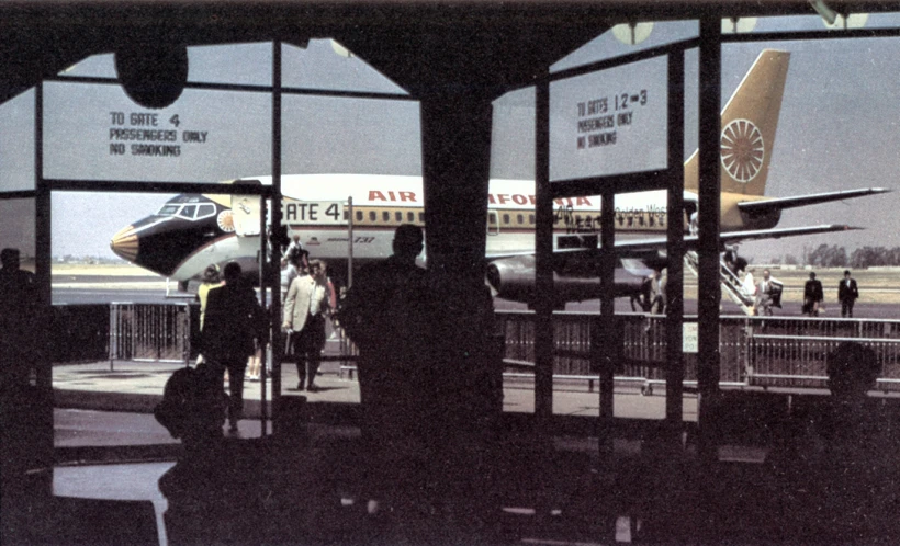 passengers waiting at an airport to board a plane
