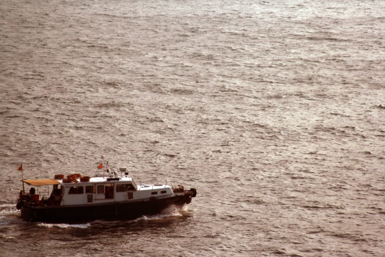 a boat going across the water in a large body of water