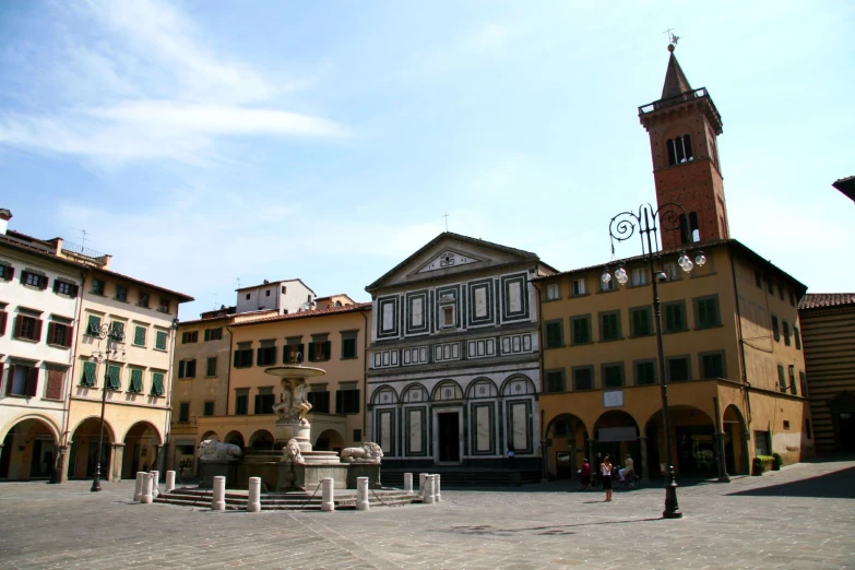 a town square with several buildings surrounding the area