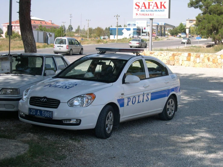 two police cars are parked in the parking lot