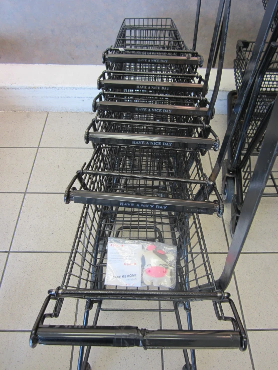 many shopping carts are shown in a line