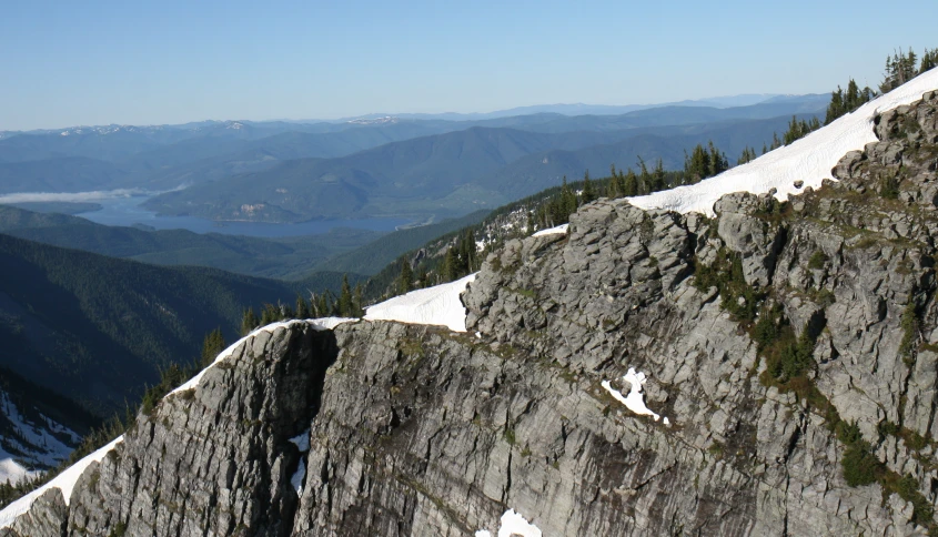 the mountains are very tall with snow on them