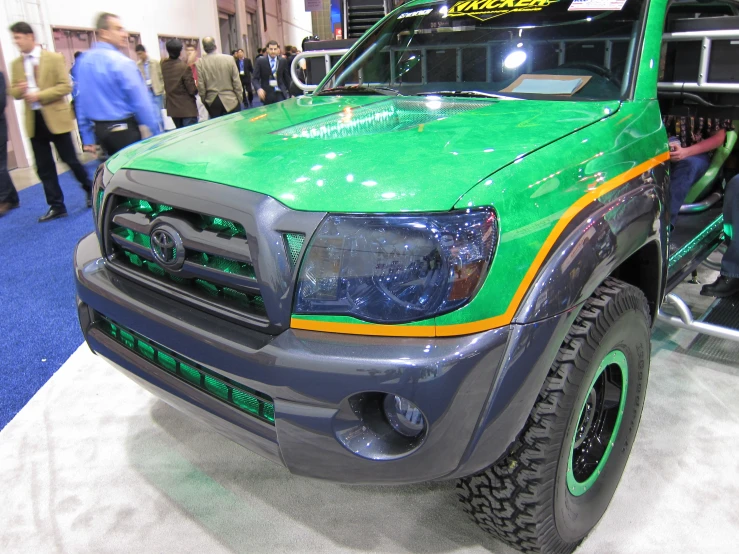 the front of a toyota truck with large tires