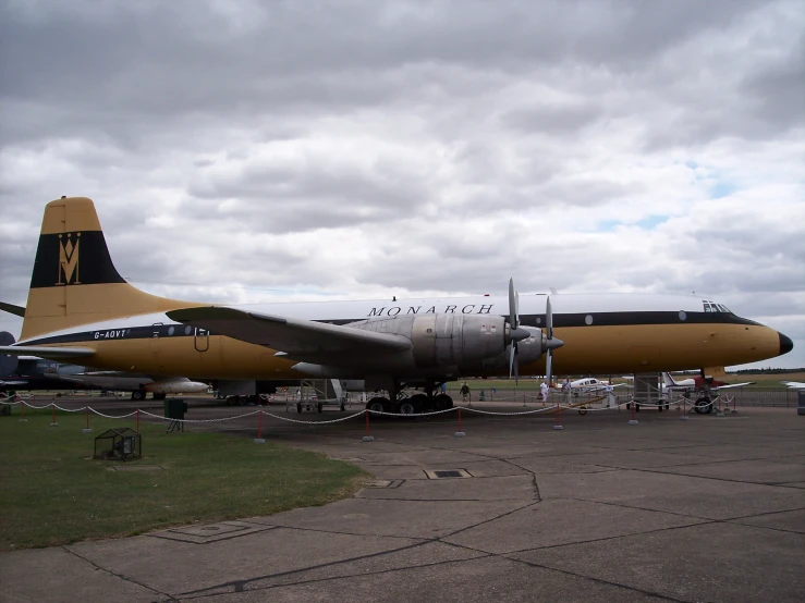 an airplane with the number 35 on it sits on the ground in a field