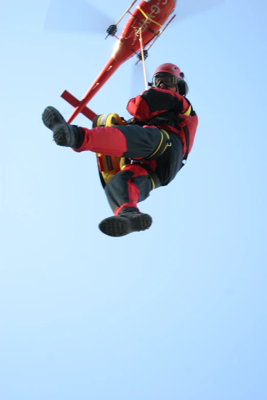 a man is skydivers over a building