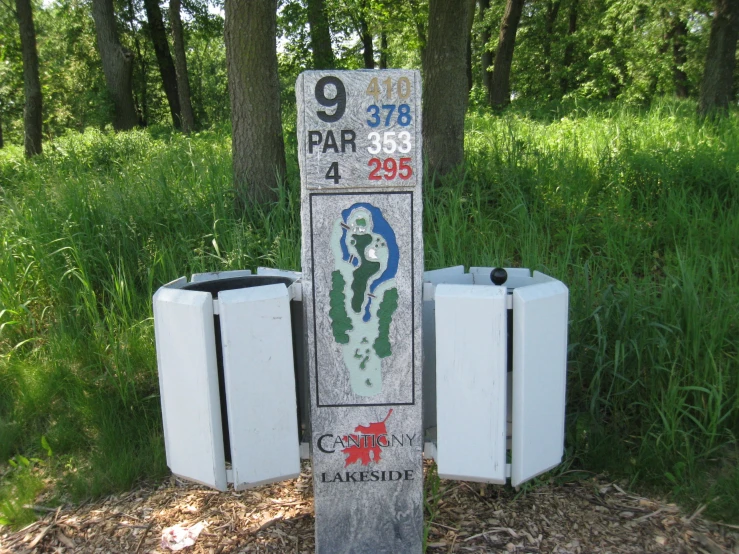a number of fridges with signs on the side of them