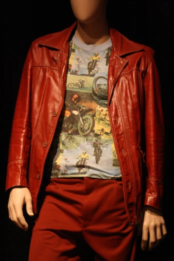 a red jacket and tee are displayed on a mannequin