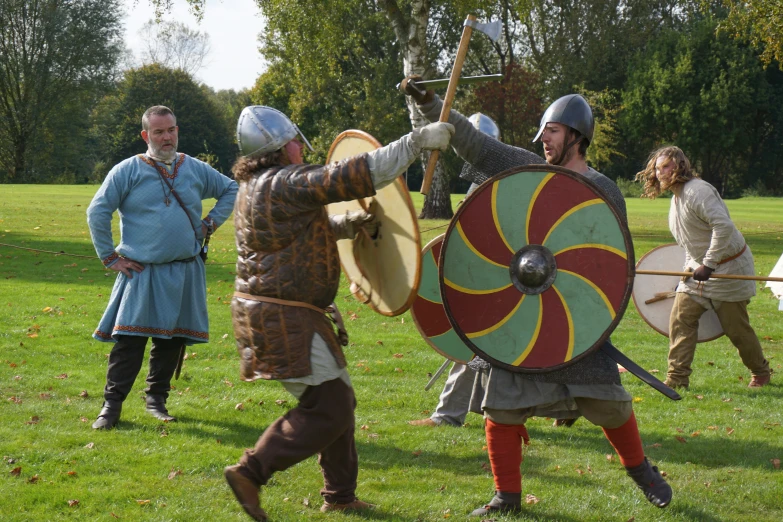 some men in costume are on the grass