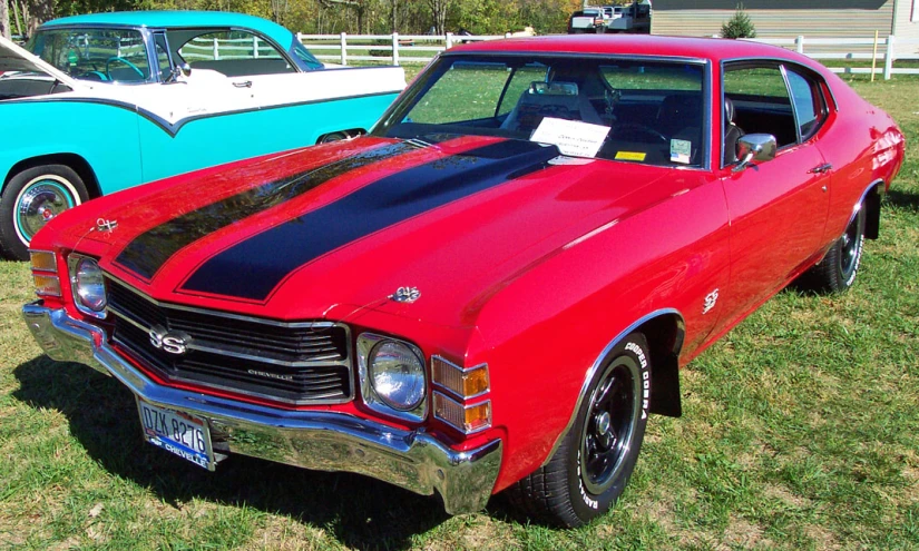 several vintage cars are on display at a car show