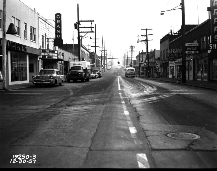 a long empty city street lined with businesses