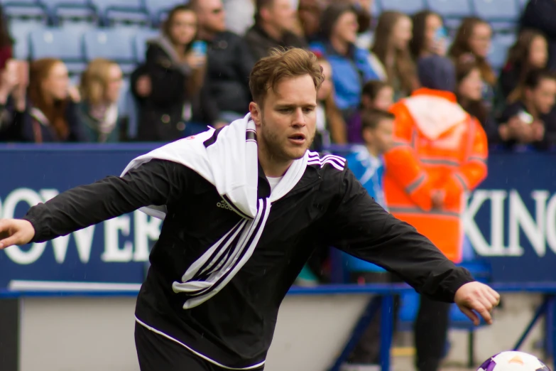 a man running with a soccer ball during a game