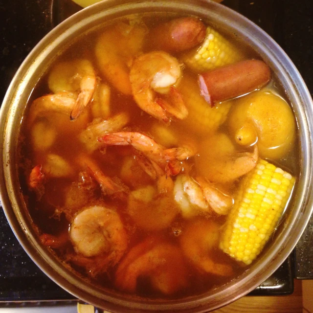 a stew with shrimp, corn, and potatoes