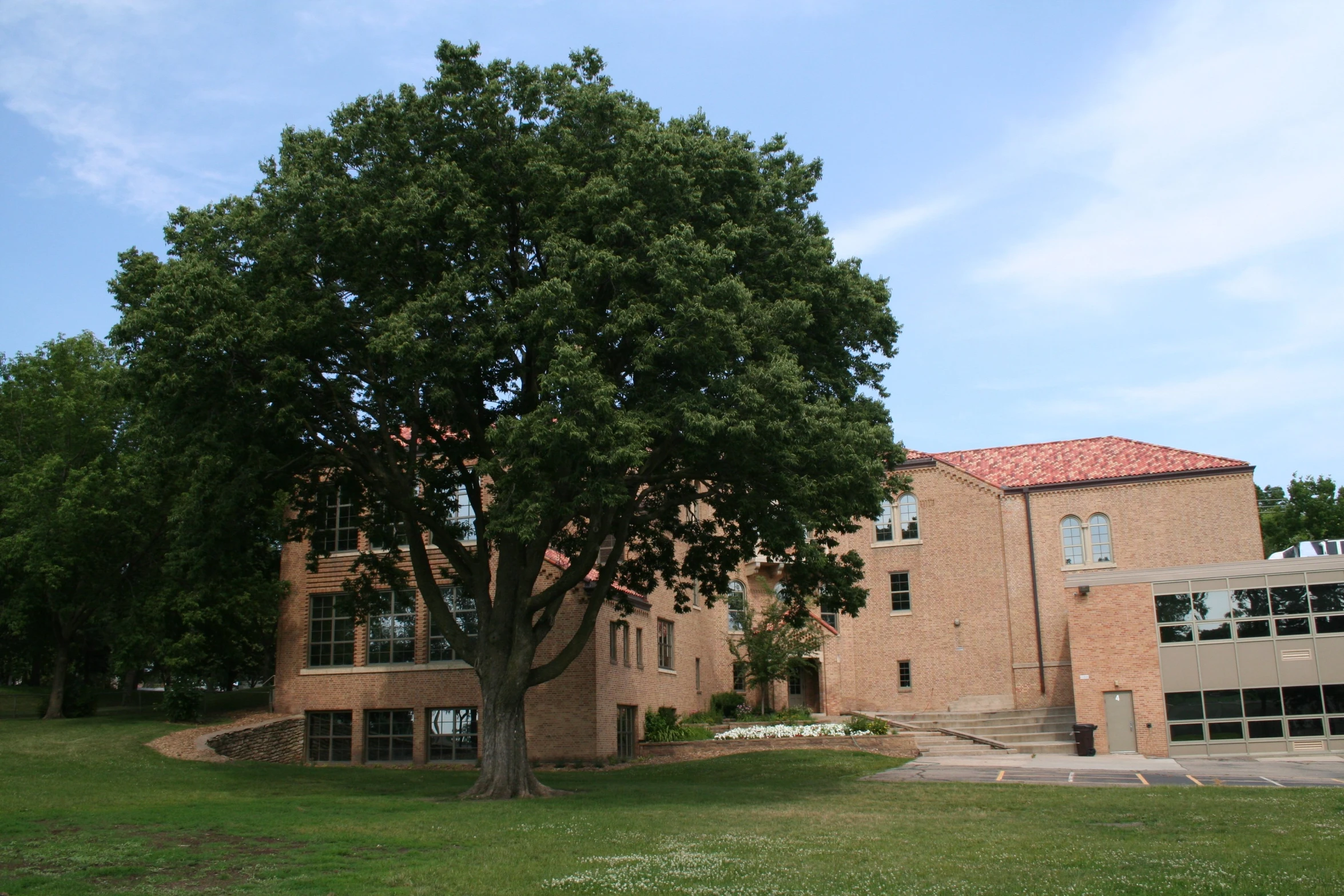 a big building with an open front yard