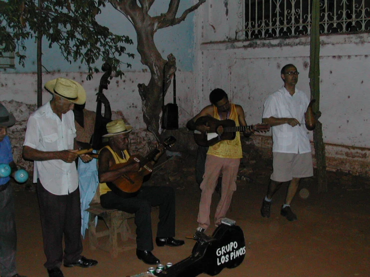 a group of men playing musical instruments together