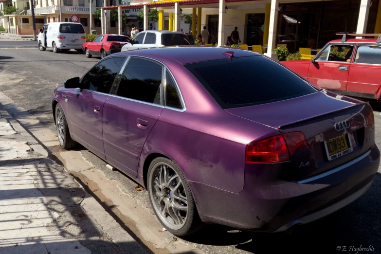 a purple car parked on the side of the road