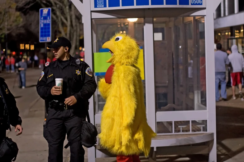 an officer is next to the chicken