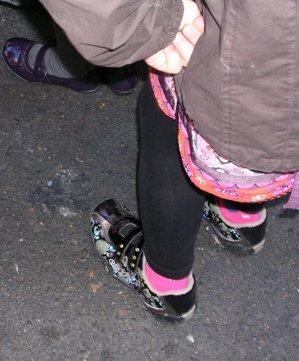 the back end of a person in snow shoes