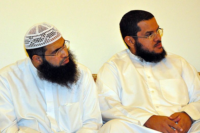 two men with large beards sitting together