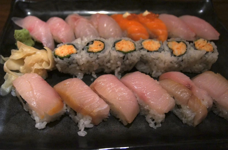 a plate topped with sushi and potatoes