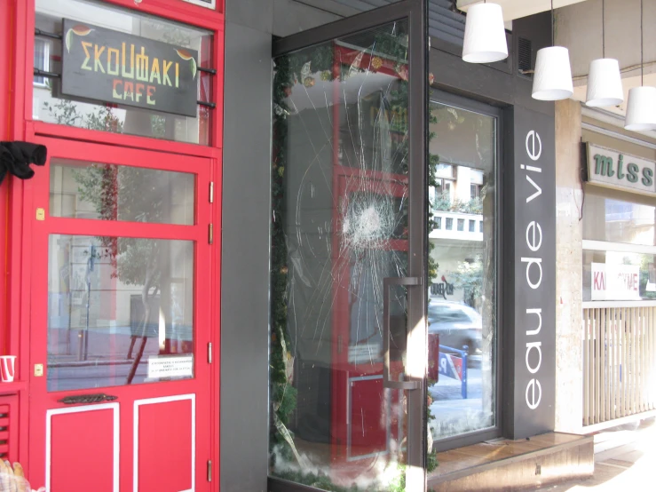 the storefront to a local restaurant on the sidewalk