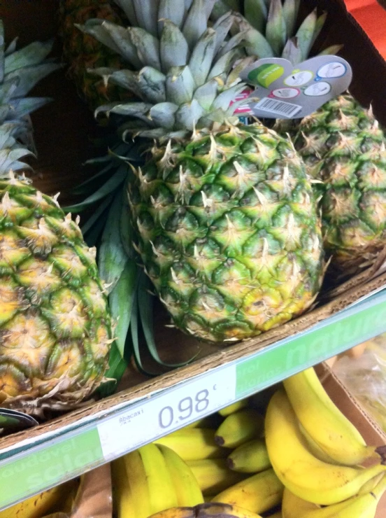 a bunch of pineapples are shown on a grocery cart