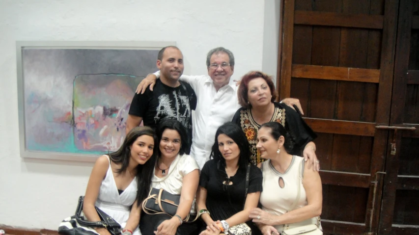 a family poses for a group po in their home