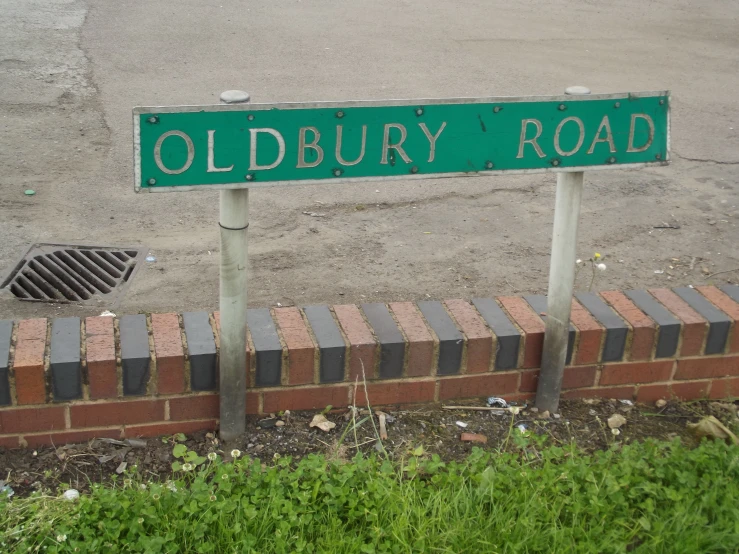 a street sign in english with an oldbury road