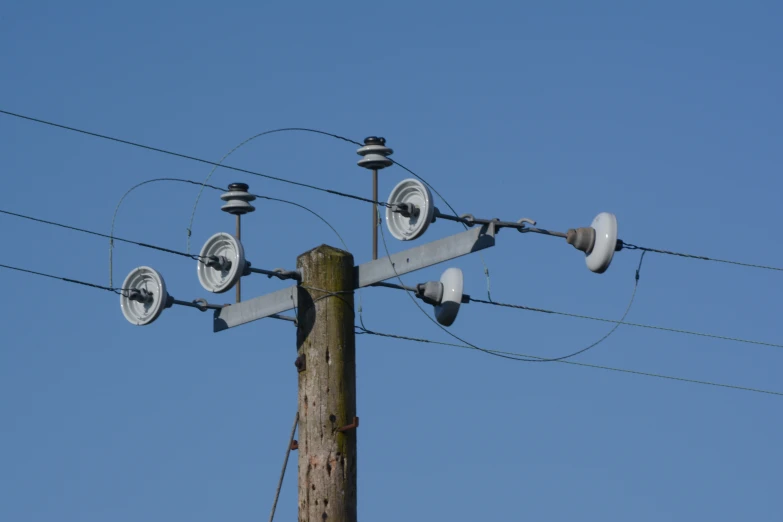 a pole with four metal outlets and no power lines attached