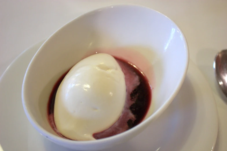 a bowl filled with some kind of dessert on top of a plate