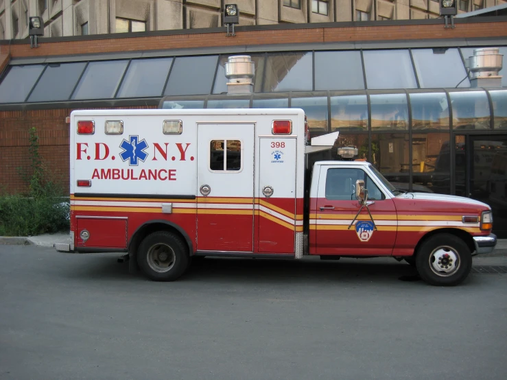 the ambulance is parked in front of the building