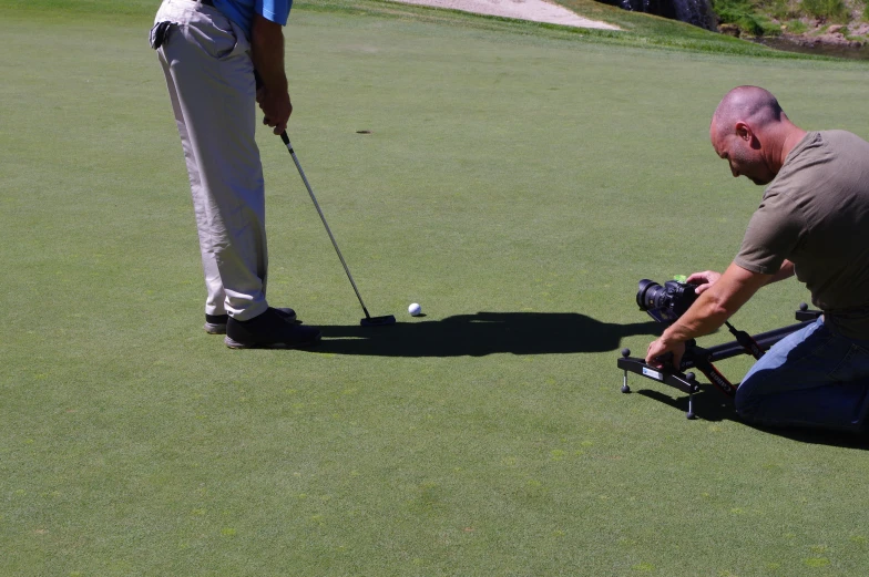 a man getting ready to swing a golf ball