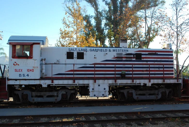 an old, train car painted with an american flag