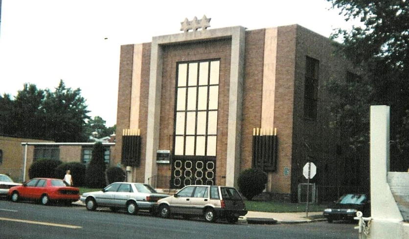 an old style building on the corner of a road