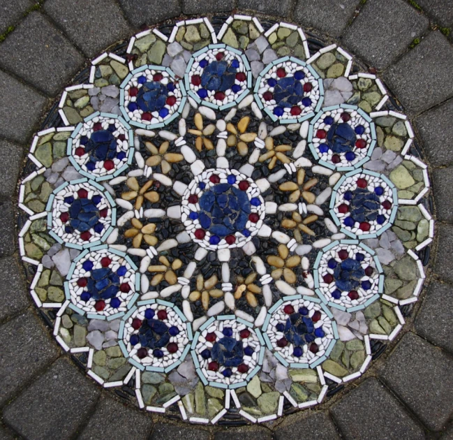 an abstract mosaic in the middle of a walkway