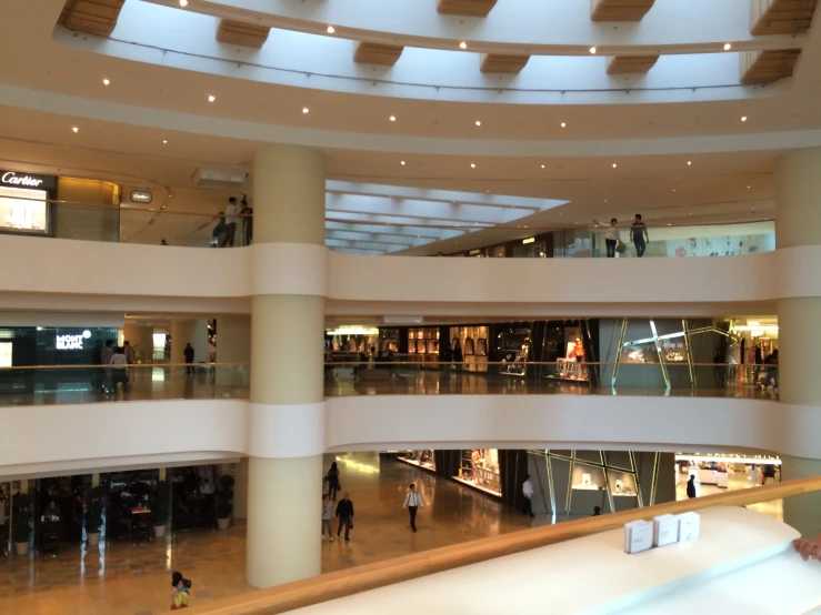 an empty shopping mall filled with shops next to each other