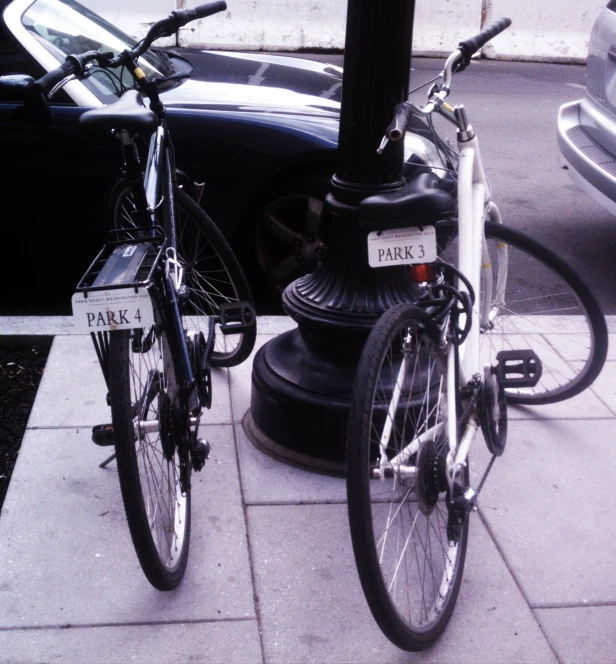 a bike that is parked near a parking meter