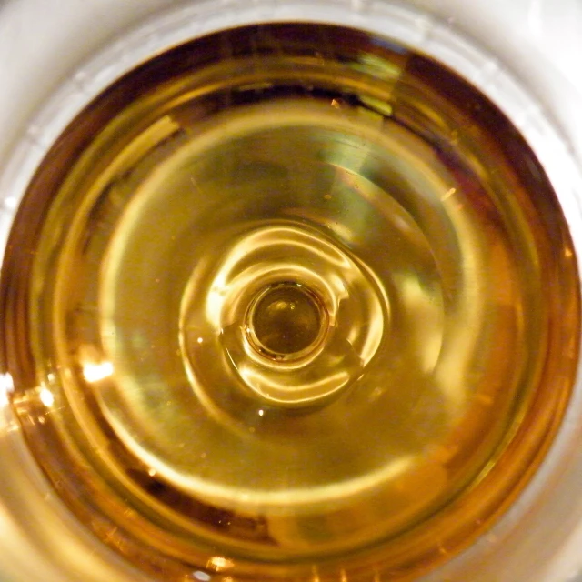 a close up view of a yellow object in a cup