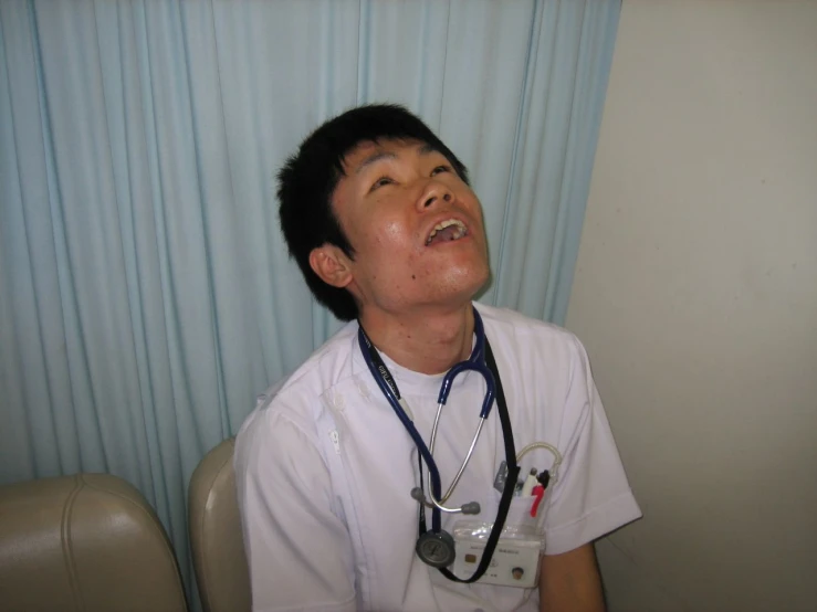 a doctor looks up in the air with his stethoscope