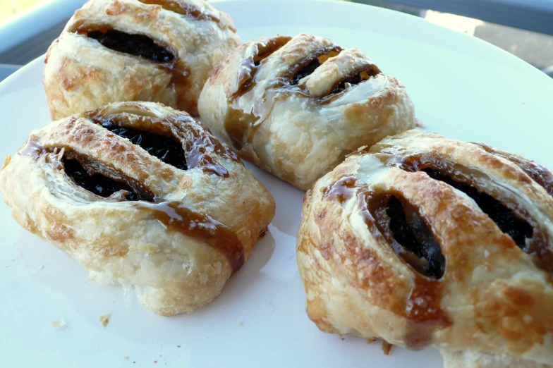 several pastries on a white plate on a table