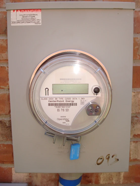 the meter is mounted to the wall of a brick wall