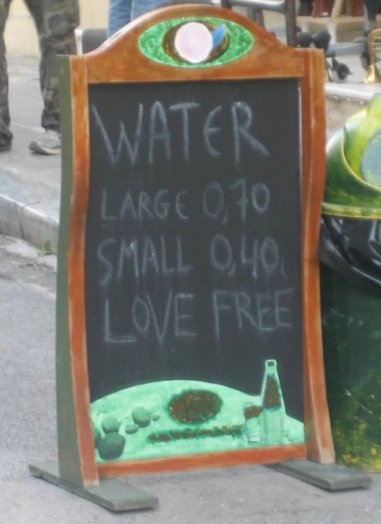 a sign saying water is large 10, small 01 love free