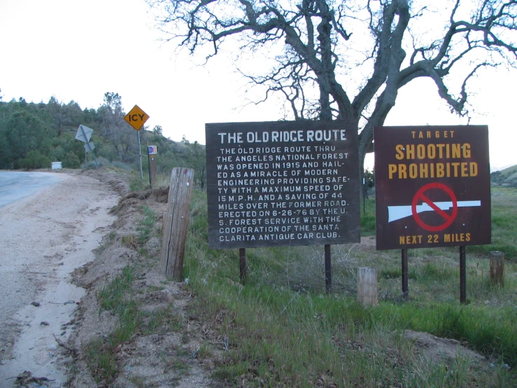 the signs point in different directions along the road