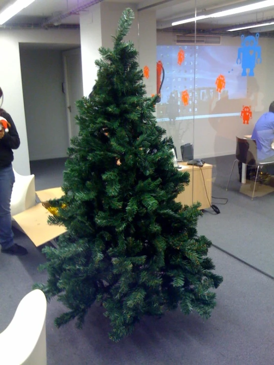 the desk is decorated with some decorations, including a large christmas tree