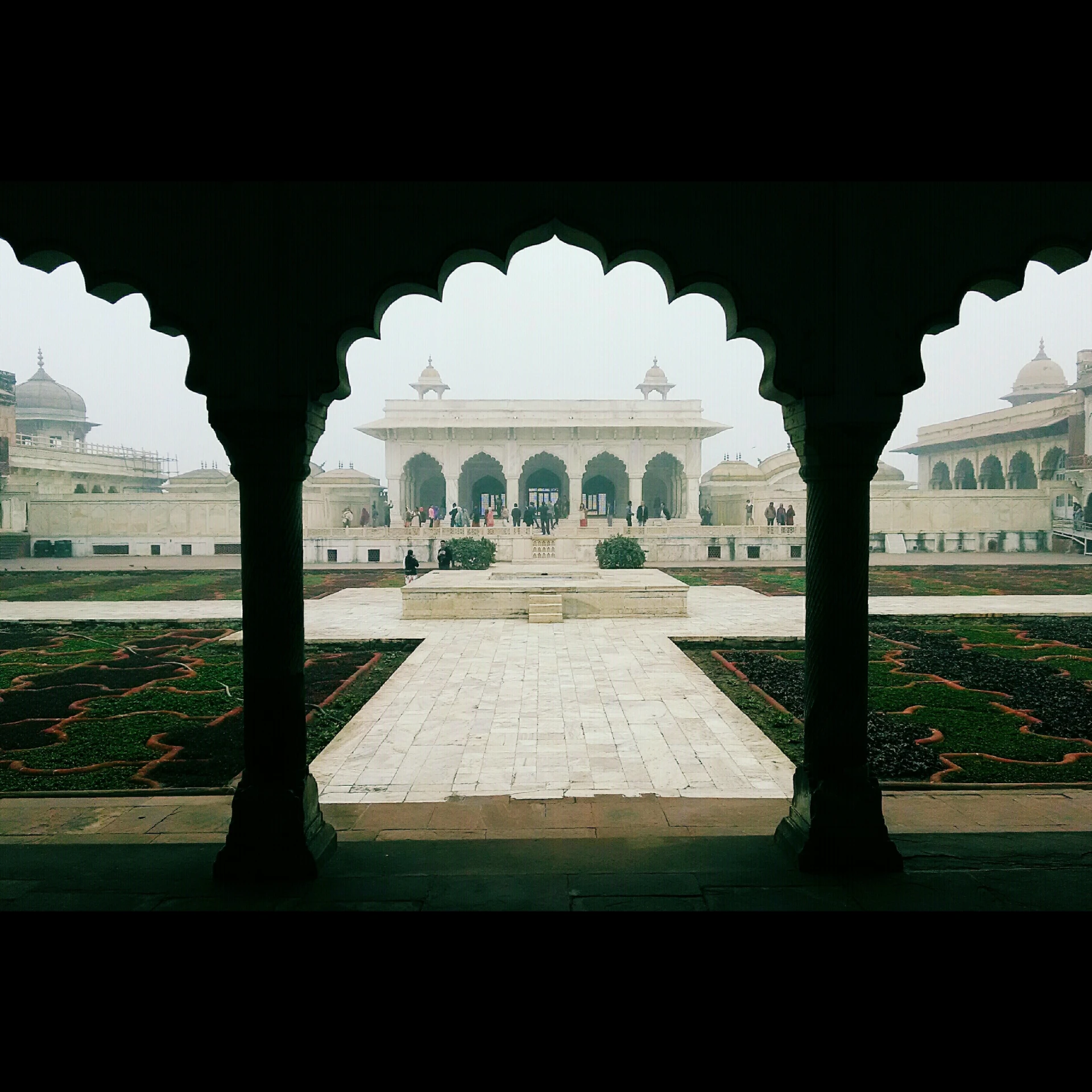 the entrance to the palace is seen through archways