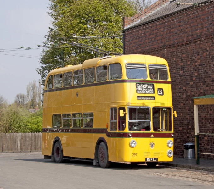 an older double decker bus that is parked
