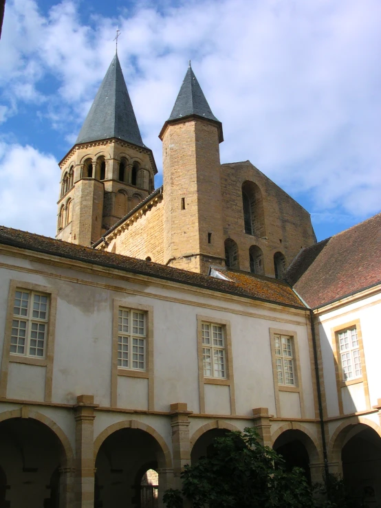 two large towers are on the top of this building