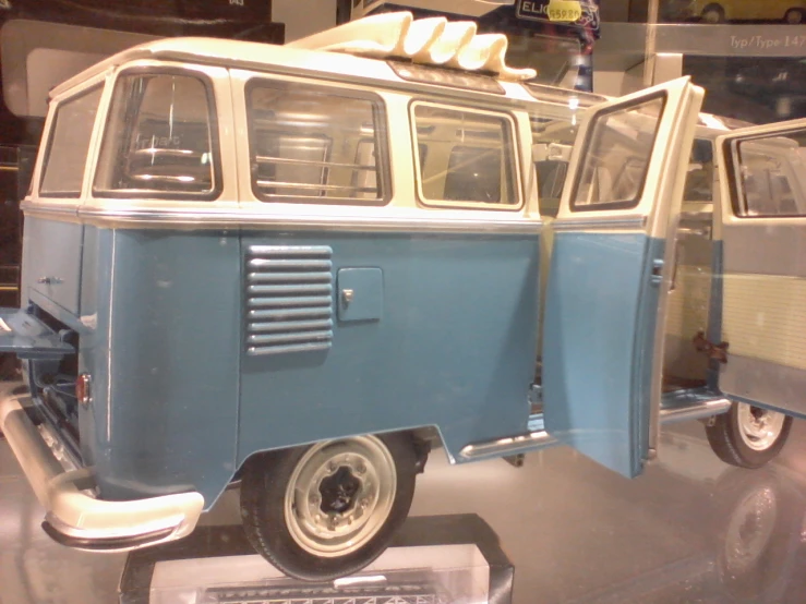 the blue and white bus is on display